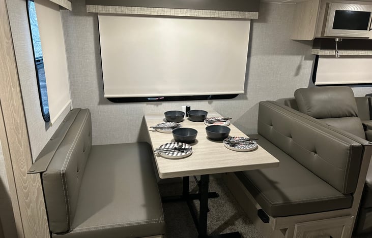 Dinig area, comfortably seats 4, we also have 2 barstools that can be seated at the island for a total of 6.