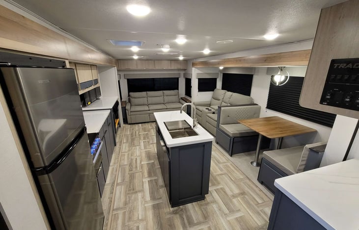 Full size refrigerator and freezer, microwave, gas cooking, and island with sink. Lots of storage.  Queen sofabed.