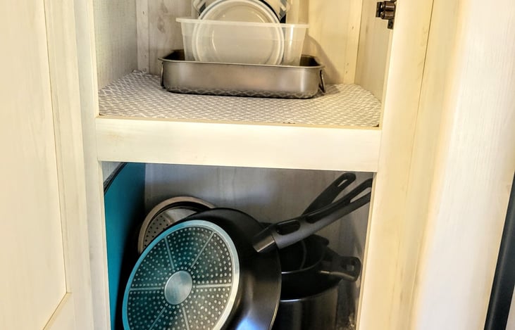 Pantry to hold pots/pans and additional storage.