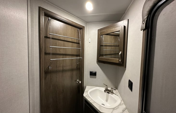 Bathroom with added over the door towel storage (actual image)