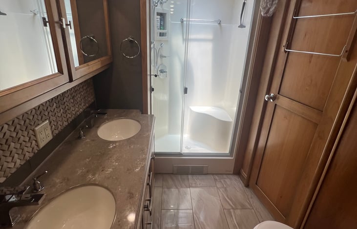 Dual sinks with stand up shower