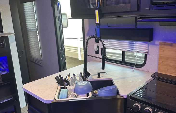 Kitchen sink with a sunlight and window! Faucet wand extends for washing dishes!