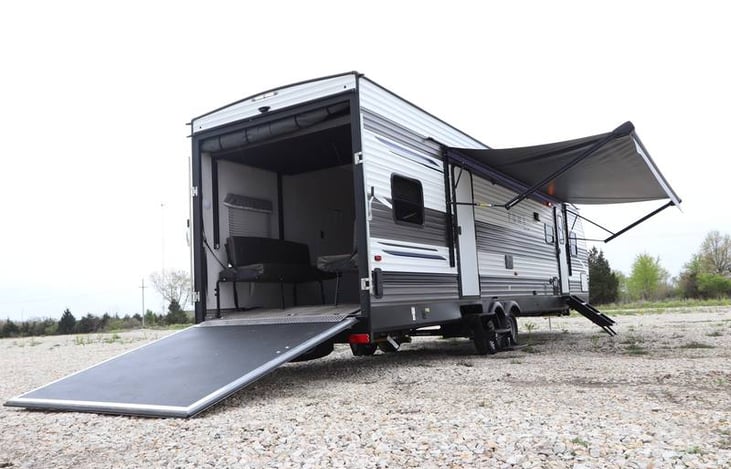 The ramp can also sit off the ground to create a patio. This stock photo doesn't show the screen porch around it.