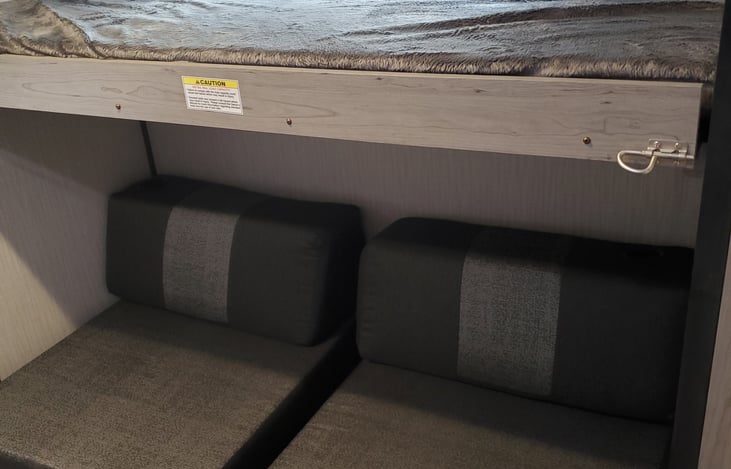 Right side of bunk room couch turns into bed for two kids or one adult.