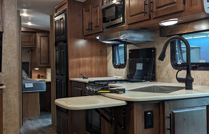 Additional prep space with pop-up counter.