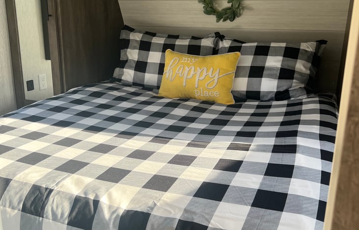 Master bedroom with closing bedroom door!  Includes mirrored closets and hangers, power outlets and usb ports on either side of the bed, a wall mounted TV with dvd player, 4 pillows and linens.