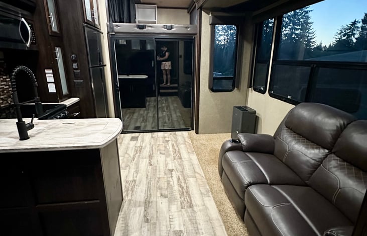 Main living space. Extra couch pieces can be included for addition seating or left out (as pictured) to allow for additional space. We use it for a kids pack-n-play!