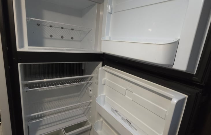 Large refrigerator plus freezer.  Electric or Gas powered