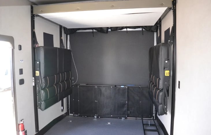 Cargo/garage has two bench seats that can be tucked up when more room is needed.