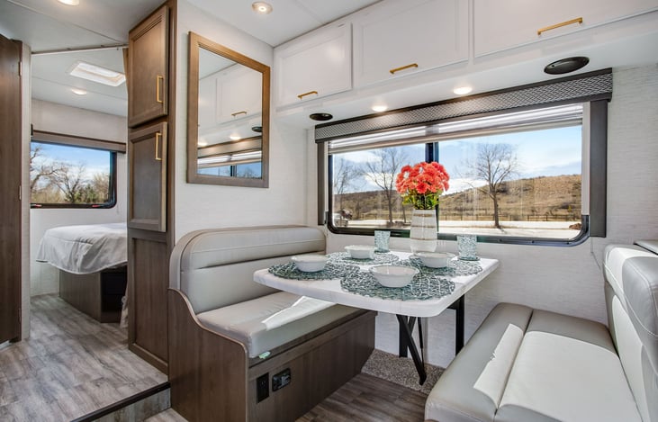 Dream dinette converts to another bed. This dinette has three seatbelts.