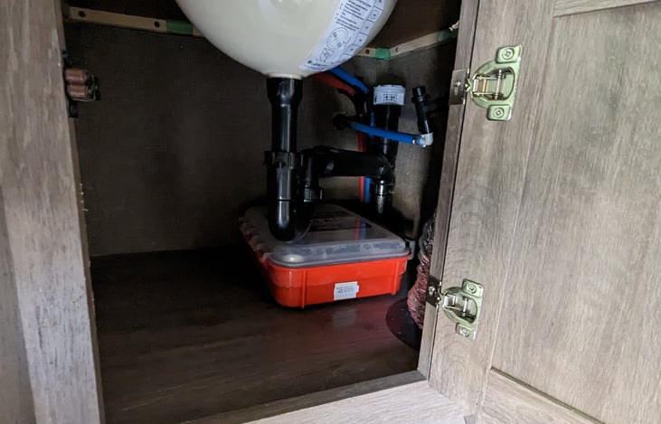 First Aid kit under bathroom sink.