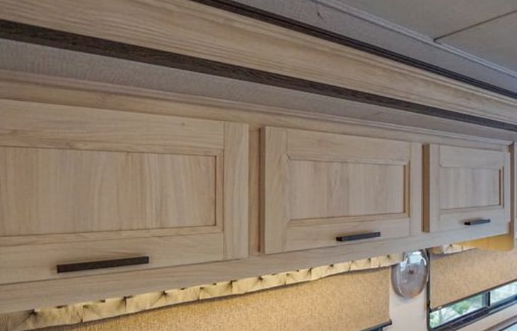 Overhead cabinets hold lots of storage.