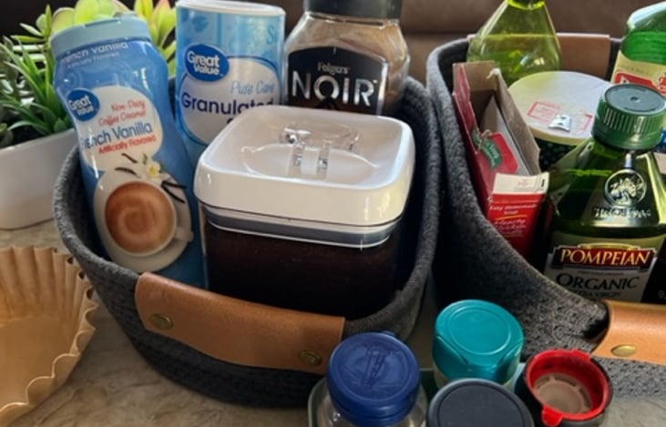 Basic kitchen essentials; coffee, creamer, sugar, oil, and seasonings.