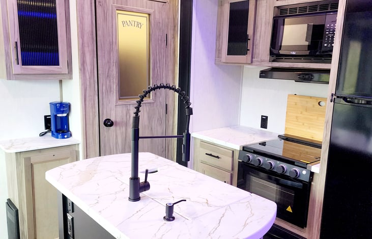 Full size pantry, coffee maker, stove & oven