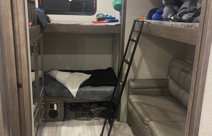 Bunk house with couch that folds into bed and 3 more bunk beds.