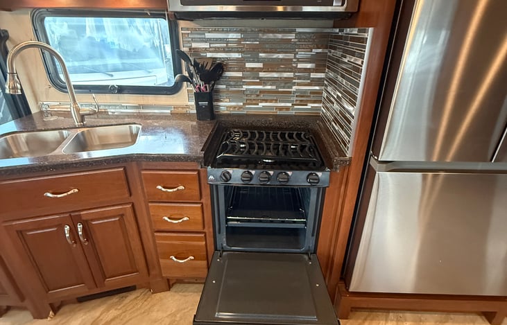 If you can dream it, you can cook it here with the full kitchen and stove option that operates on propane gas.