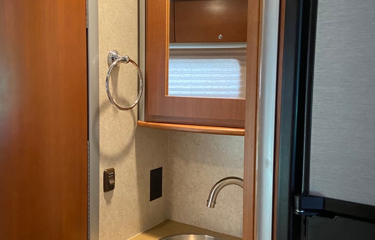 Sink and medicine cabinet.