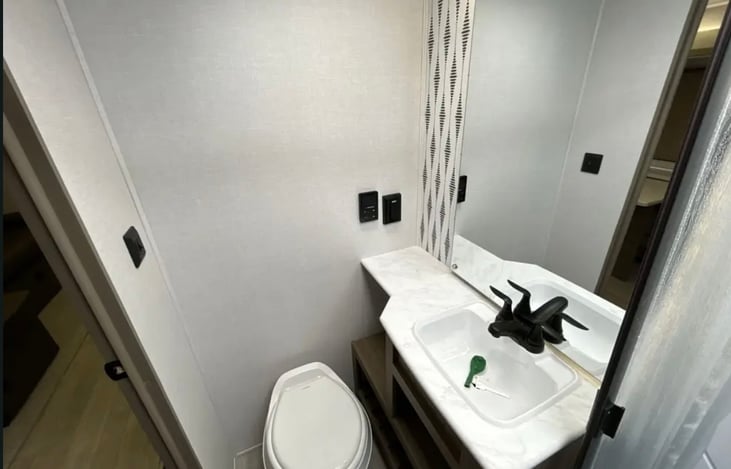 Bathroom sink has good amount of storage underneath.