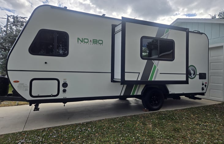 Slide out for a spacious dining area/convertible sleeping area