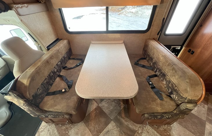 Main dinette with seatbelts deployed