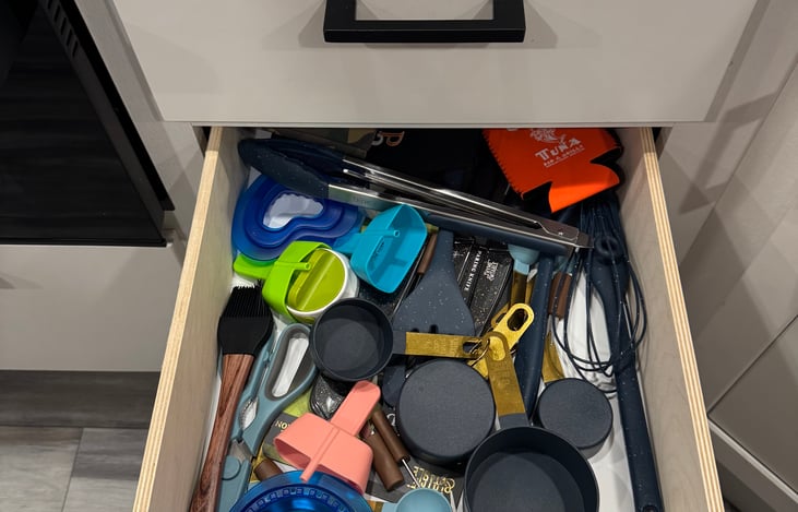 Fully stocked kitchen! Cooking utensils, measuring cups, can opener, pizza cutter, beer and wine opener, sandwich cutters, popsicle holders and koozies