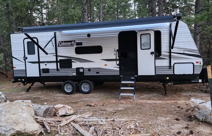Trailer with awning extended and outdoor LED lights