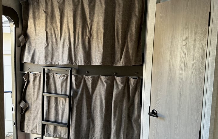 each bunk has a privacy curtain