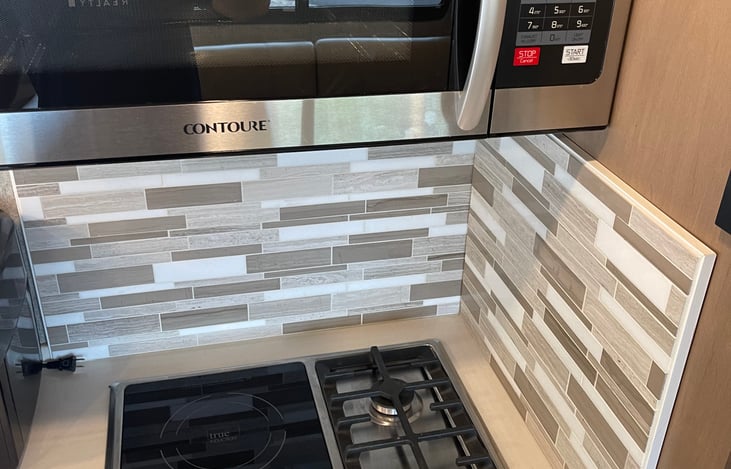 Electric and propane options for cooking stovetop. Also a microwave that has baking capabilities too.