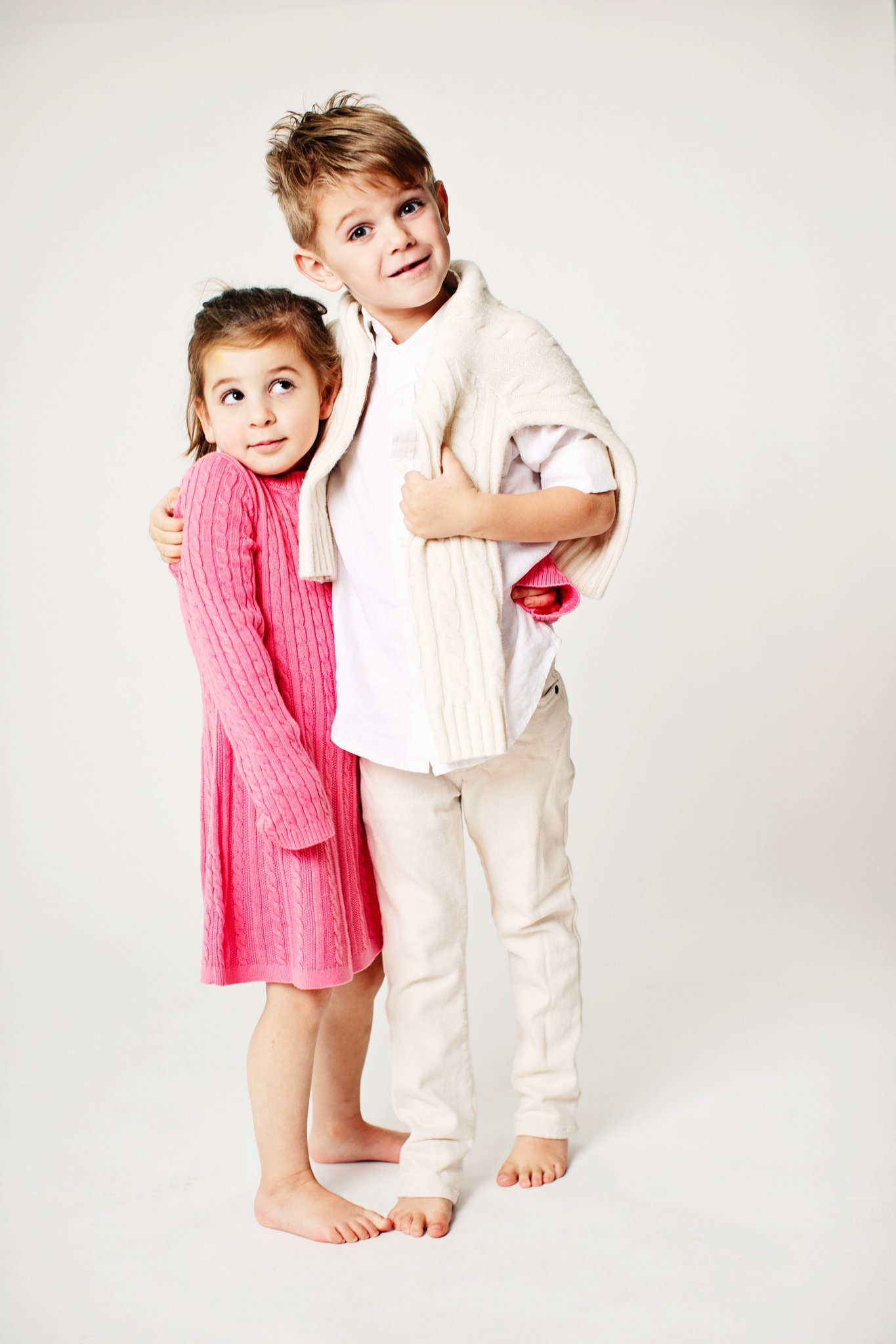 A brother and sister standing together