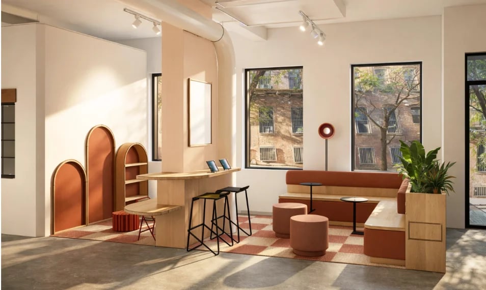 The daysee lounge, with arched backdrops, a wood counter and a banquette under the storefront windows