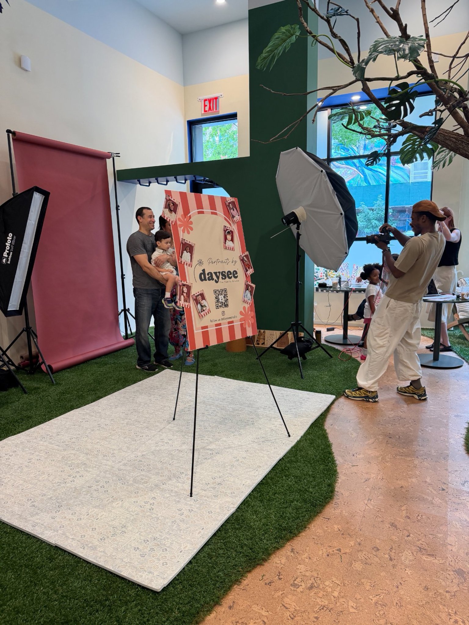A Daysee pop-up set with backdrop, lighting and signage