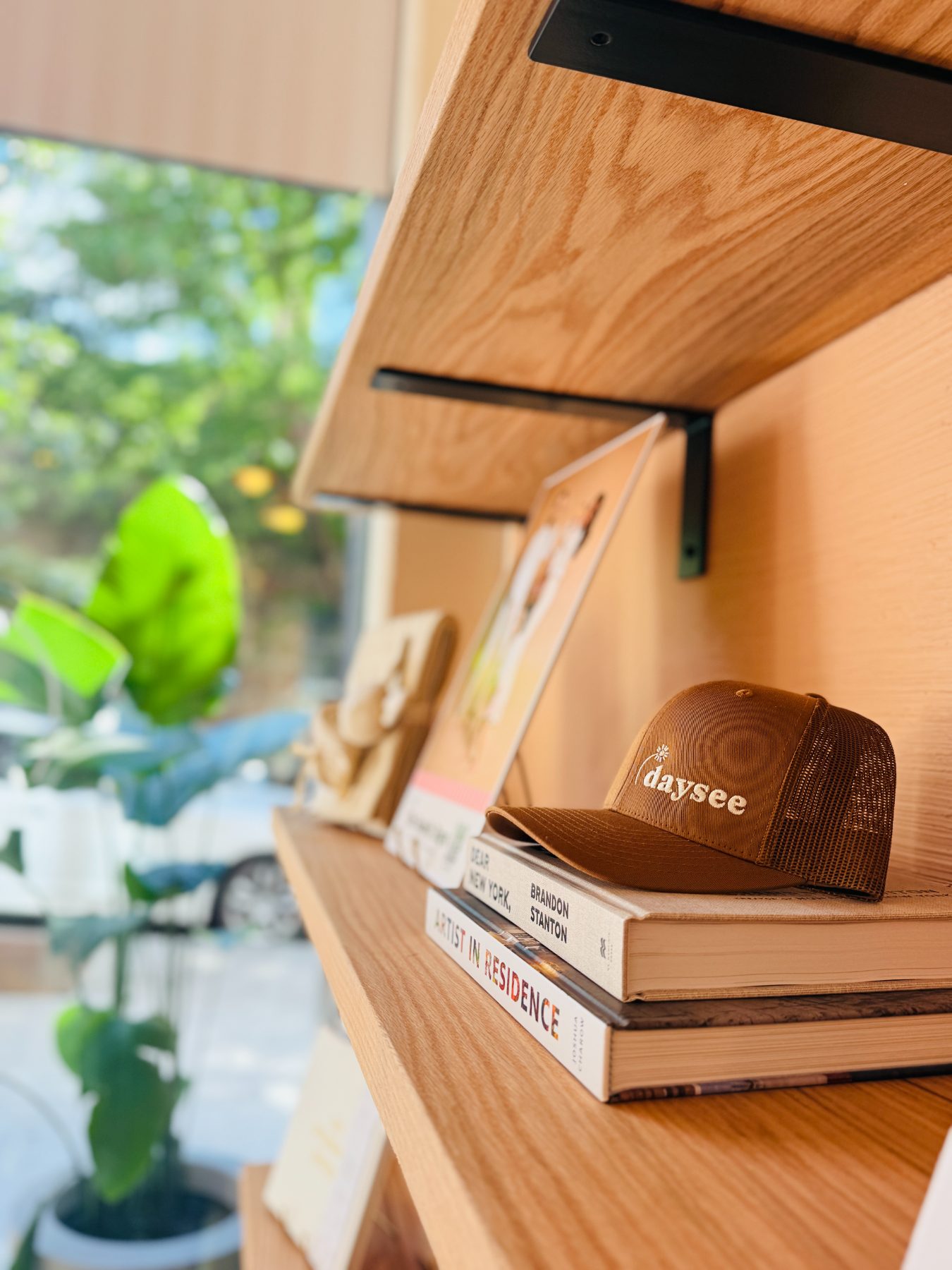 The entry retail shelves with books, caps and gifts