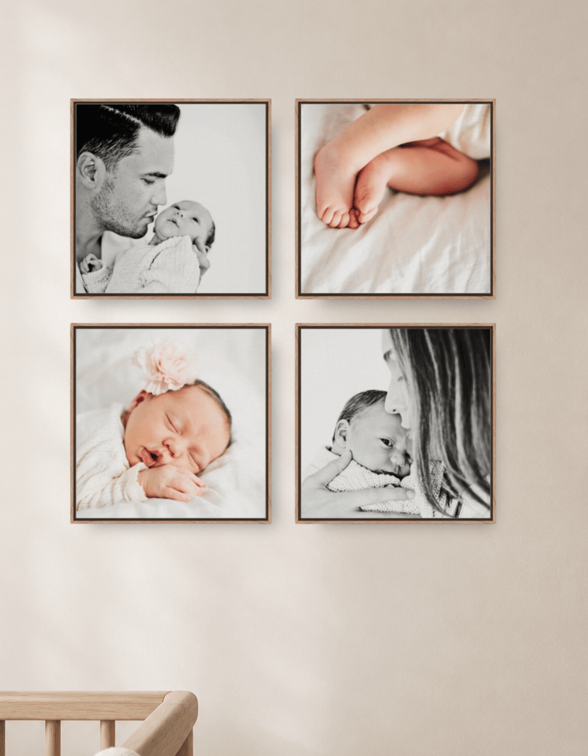 Four square framed canvases of a newborn hung two by two above a crib