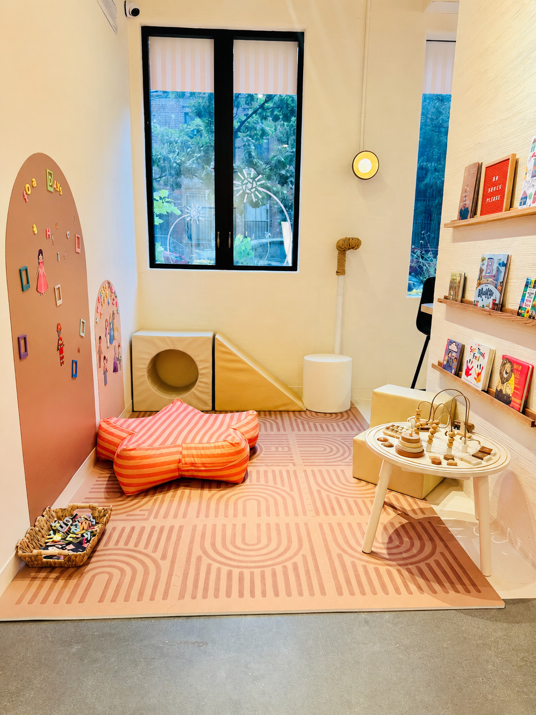 The kids corner with play mat, soft blocks and picture books
