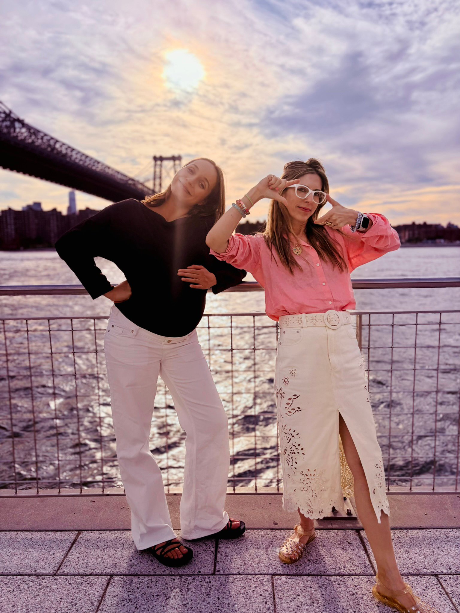 Two of the daysee team on the East River waterfront at sunset