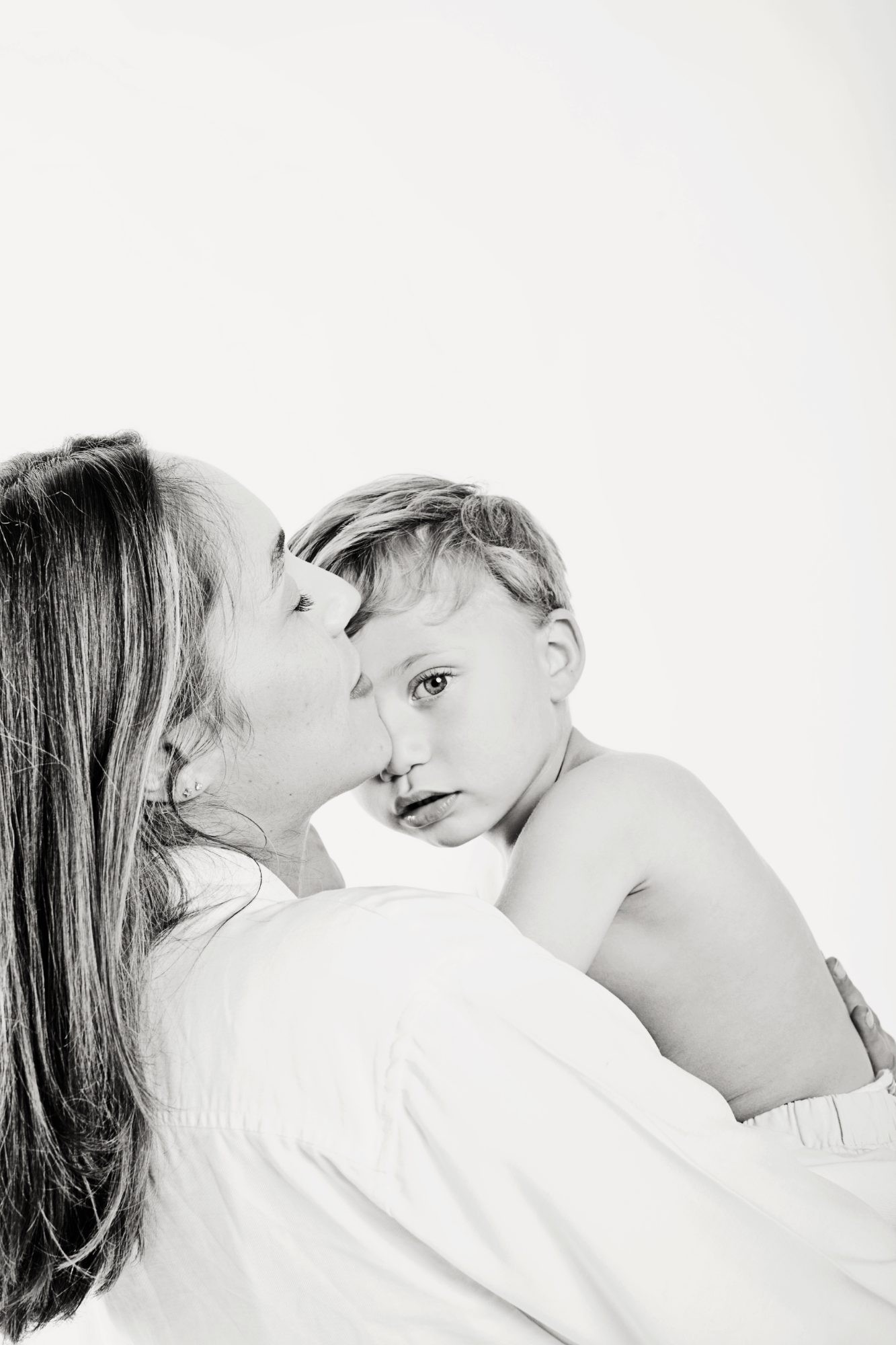 Mother kissing her son