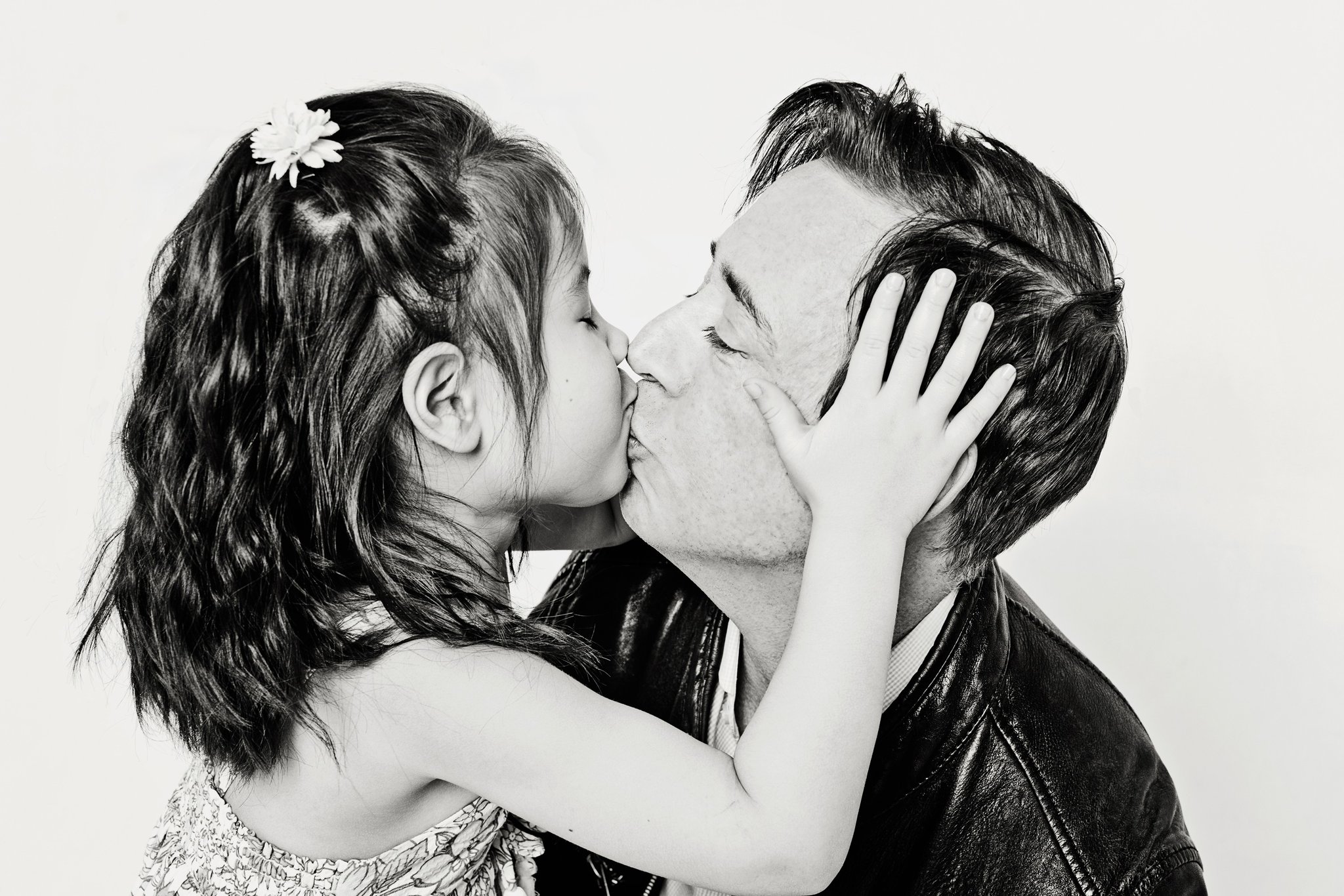A girl kissing her dad