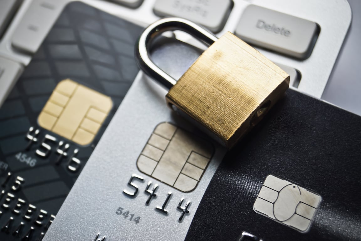 Padlock on credit cards depicting secure payment gateway in hotels