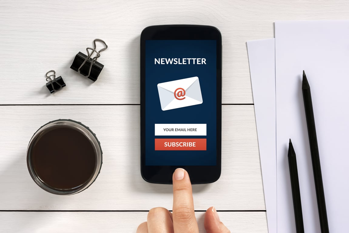 Smartphone displaying a newsletter subscription page.