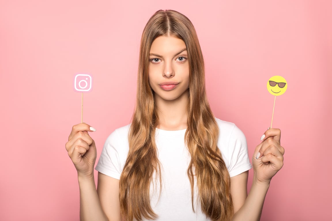 Woman pausing for a funny instagram picture.
