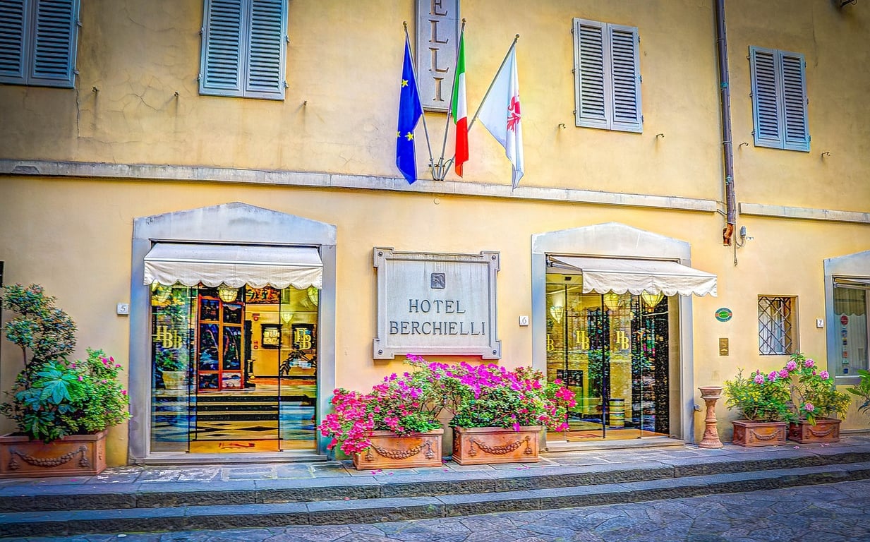 Photo of a hotel facade with graphics indicating positive PR perception.