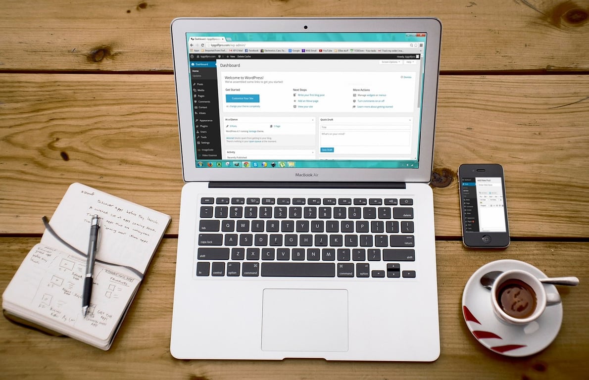 Laptop displaying hotel website management software, symbolizing a robust online presence for hospitality marketing