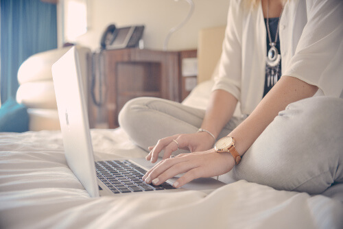 Person searching online to book a hotel room in advance