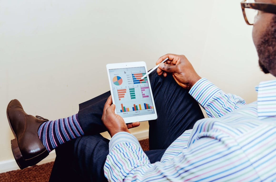 Man reviewing data on a tablet
