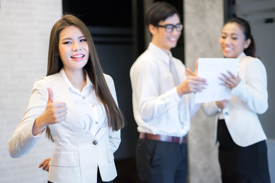Confident hotel manager delegating tasks to employees