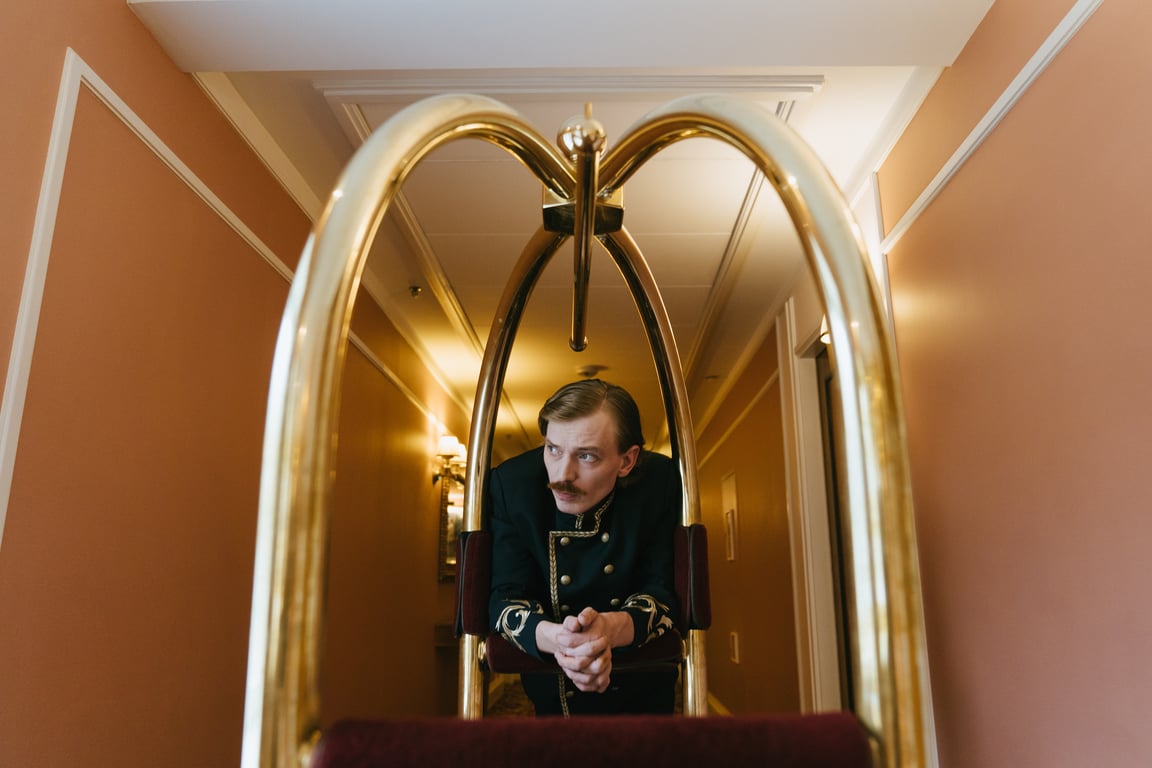 Hotel groom in corridor