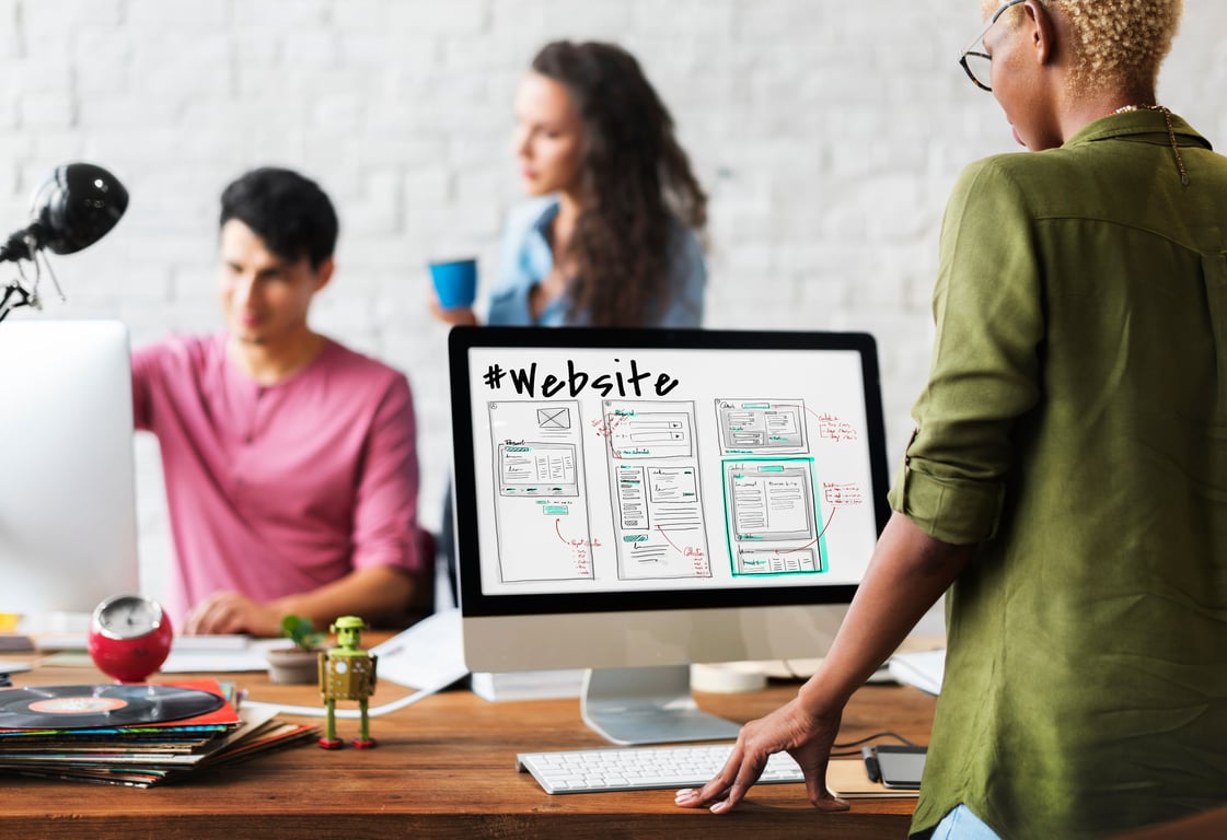 Team collaborating on a hotel website design to enhance online guest experience