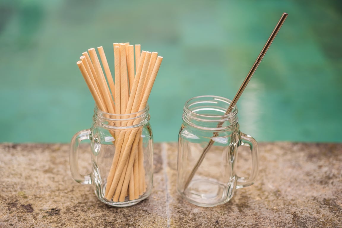 Reusable paper and metal straws as eco-friendly options in hotels.