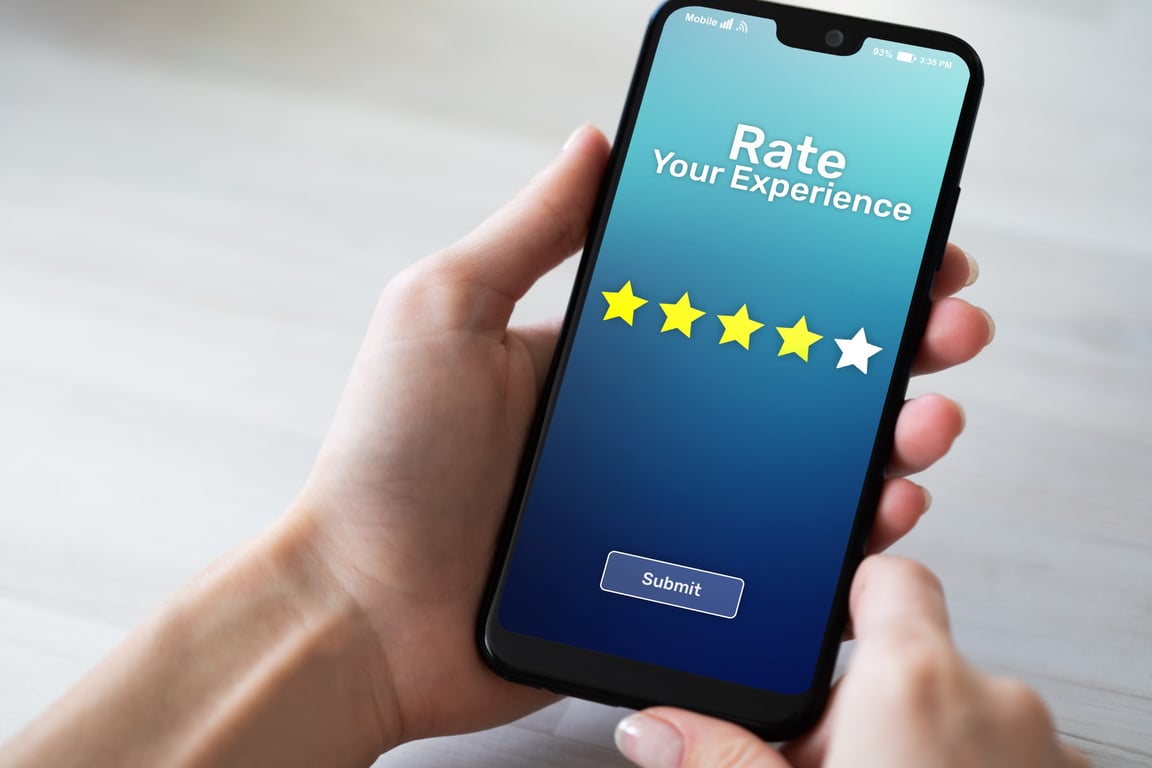 Guest writing a review on a smartphone