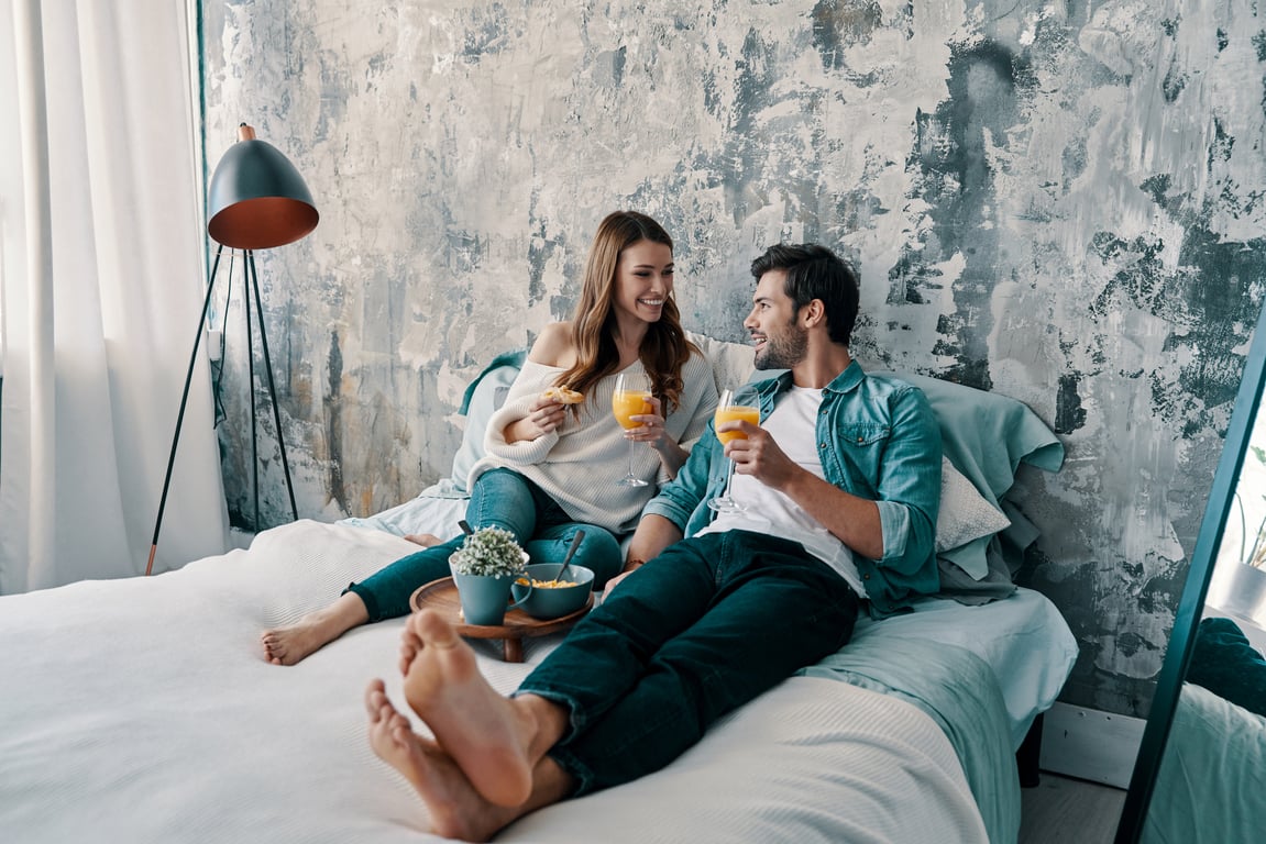 A couple enjoying a relaxed hotel experience, indicative of tailored guest satisfaction